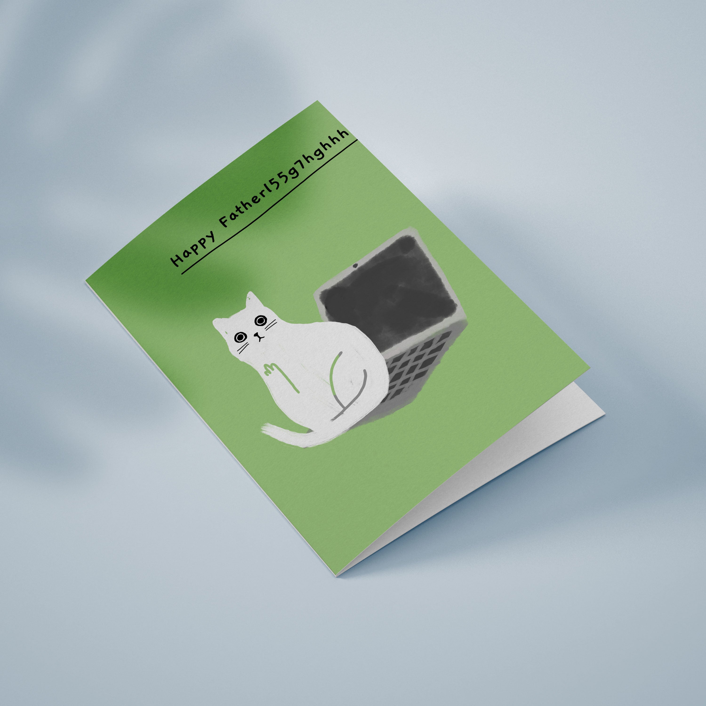 Ken the cat Father's Day card - Laptop typo - Ken sitting on laptop on green background