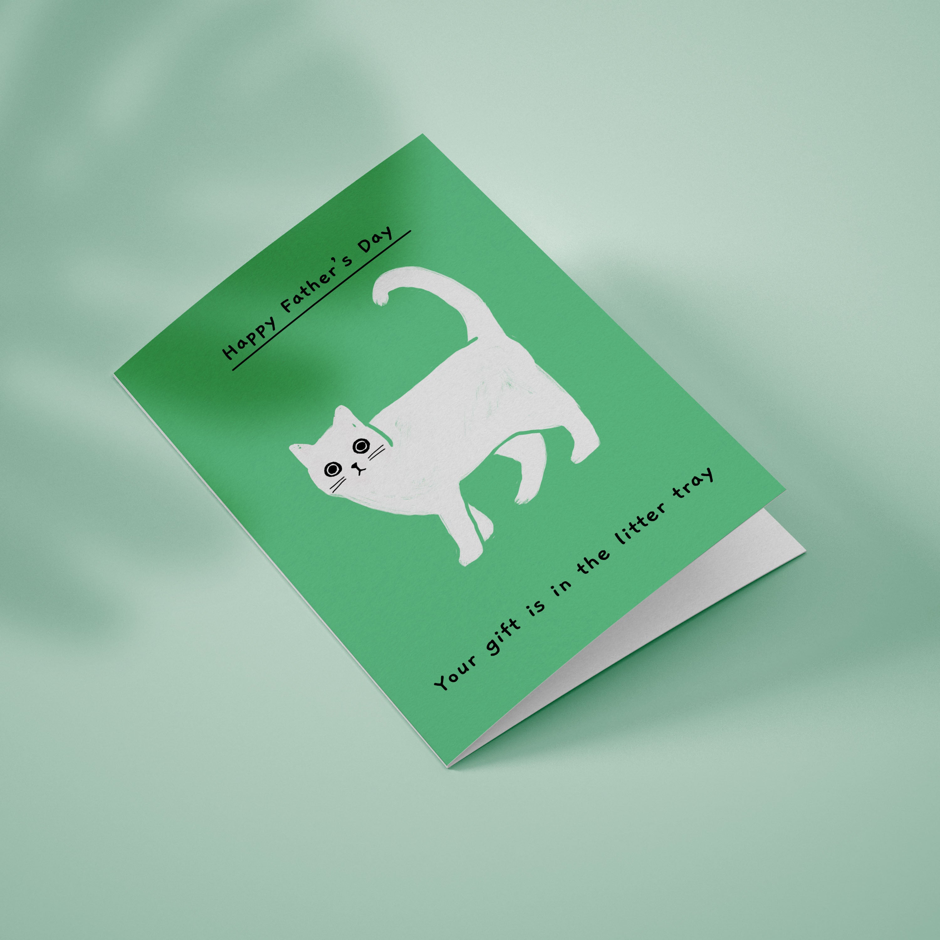 Ken the cat Father's Day card - Your gift is in the litter tray - Ken walking on green background