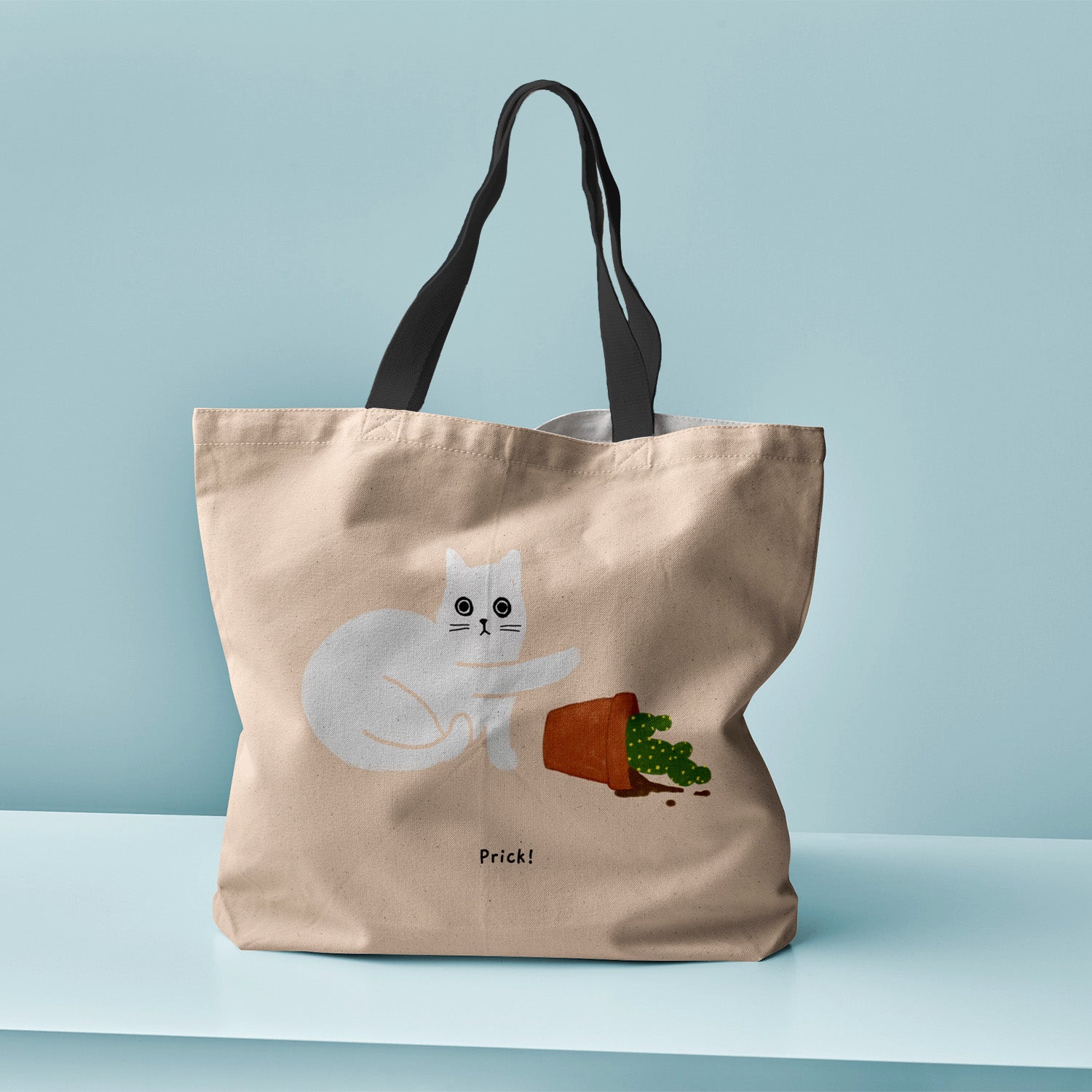 Ken the Cat pushing over cactus tote bag with caption ' Prick!' - durable eco friendly shopper with black handles